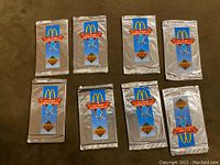 Eight sealed 1994 Upper Deck hockey trading card packs with McDonald's promotional branding, unopened foil packages laid out on a flat surface.