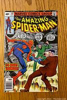 Front cover image showing Spider-Man in a dire situation with two men, cover marked 40¢ and issue number 192 dated May.