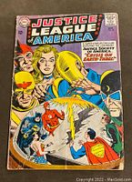 Front cover of Justice League of America #29 comic book showing main superheroes and title.