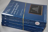 Four academic lecture transcript books stacked and secured with a rubber band. Titles visible: Mathematics, Philosophy, and the 'Real World' (two volumes), The Secrets of Mental Math, An Introduction to Astronomy.