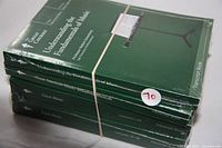 Four sealed Great Courses books bundled with a rubber band