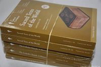 Stack of 4 of the sealed Great Courses books tied with rubber bands, showing side spines with titles and lecture numbers
