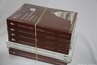 Photo of all 7 Great Courses history books, stacked and sealed in original plastic shrink wrap. Four volumes of The History of the United States, two volumes of America and the World: A Diplomatic History, and one volume of The Skeptic's Guide to American History visible.
