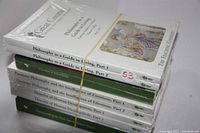 Stack of 8 sealed Great Courses books on philosophy topics, with one unsealed book visible in the stack, photographed from an angle.