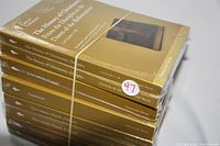 Stack of eight sealed paperback books from The Great Courses Academic Lecture Series on Religion and Theology, Christianity topics. Covers all in gold color with white title text.