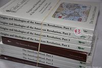 Photo showing four volumes of 'Origins and Ideologies of the American Revolution' and three volumes of 'The American Mind', all sealed in original shrink wrap.
