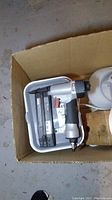 Photo showing Porter Cable BN200SB nailer with nails in box