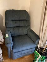 Front view of blue corduroy recliner showing overall condition