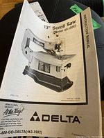 Instruction manual booklet showing Delta 13 inch scroll saw, model 40-130C, dated 7-81.