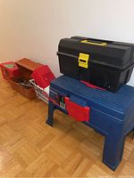 Photo of all tool boxes and storage items arranged in a row.