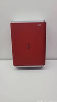 Front view of red Cintas paper towel dispenser mounted on wall
