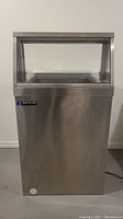 Full front view of stainless steel display freezer