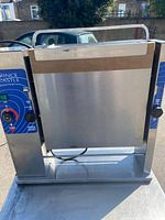 Front view of single toaster showing stainless steel faceplate and control panels.