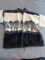 Full front view of the vintage 1980's Ezze Wear faux fur jacket showing soft plush material with black, gray, and white color bands and tree silhouette pattern.