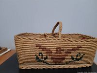 Front view showing bird motif and overall rectangular shape