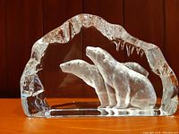 Front view of the glass sculpture showing two frosted polar bears and the clear ice arch.