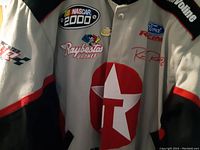 Front view close-up of Nascar 2000 jacket showing Texaco, Raybestos, Ford Racing logos and Ricky Rudd signature.