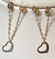Front view of pair of 10K gold drop earrings with chains and heart pendants.