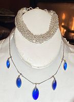 Front view of 14 inch sterling silver choker necklace with five blue marquise-shaped enamel charms.