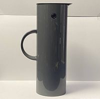 Side view of gray Stelton Denmark thermal vacuum jug carafe with round handle and push-button on lid