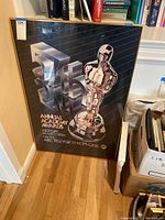 Framed 57th Annual Academy Awards poster showing entire poster face and frame.