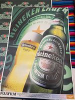 Heineken lager beer poster showing bottle and glass on Fiji Film satin photo paper with staple holes in white border