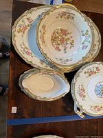 Photo showing the oval platter, oval bowl, and gravy dish with ornate floral and gold trim design