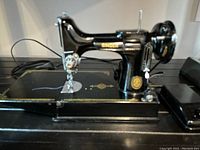 Front-right perspective showing overall machine, base and decorative decals