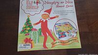 Top view of the Elf On The Shelf Naughty or Nice Board Game box.