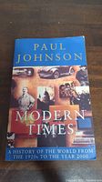 Front cover of the book 'Modern Times' showing title, author, and various historical image montage.
