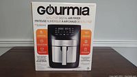 Box of Gourmia 6.7L/7QT Digital Air Fryer showing image of the unit and key features.