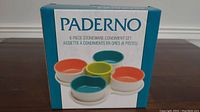 Photo of the Paderno 6 Piece Stoneware Condiment Set packaging showing 6 bowls in multiple colors.