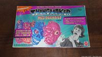 Front of the Thingmaker Mad Scientist set box showing colorful monster heads and retro image of scared woman