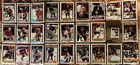 Photo showing 18 hockey cards featuring Brett Hull and Ray Bourque with various team and All Star designs