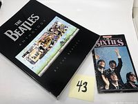 The Beatles Anthology book and Newsweek The Sixties magazine side by side showing front covers.