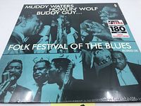 Front cover of Folk Festival of the Blues vinyl LP featuring Muddy Waters, Howlin' Wolf, Buddy Guy with Vinyl Lovers 180 gram sticker, still sealed.