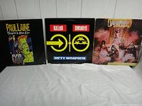 Three heavy metal vinyl albums - Paul Laine, Killer Dwarfs, and W.A.S.P. shown side by side