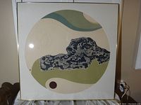 Full view of framed 'Fourth Dimension' print showing abstract circular design with muted colors and patterns.