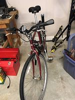 Front angle view showing bicycle frame, front light, handlebars, and front wheel.
