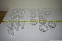 Top view showing a collection of clear glasses of different shapes and sizes arranged on a table