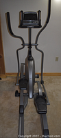 Full view of Vision Fitness X6200 elliptical machine showing console, handlebars, pedals, and frame