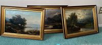 Three oil paintings arranged side by side