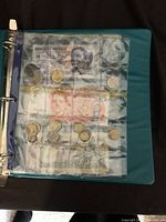 Photo of binder page showing Mexican currency and coins in plastic sleeves