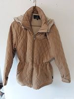 Front view of the light brown quilted London Fog jacket showing diamond pattern, zip front, elastic waistband, and detachable hood.