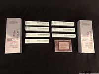 Photo showing two boxed L'Oréal Vitamino Color hair masks and seven Bodyography lipsticks plus a soap bar.