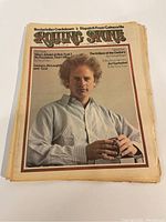 Front cover of the 1973 Rolling Stone magazine featuring a portrait of a man with curly hair in a collared shirt.