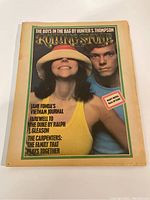 Front cover of 1974 Rolling Stone magazine featuring a woman in a hat and a man, with headlines referencing Hunter S. Thompson, Jane Fonda, The Carpenters, and others.