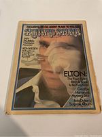 Front cover of Rolling Stone magazine Jan 1974 issue showing Elton John with smoke effect and magazine headlines.
