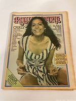 Front cover of 1975 Rolling Stone magazine featuring Carly Simon in a striped dress.