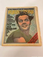Front cover of the 1975 issue of Rolling Stone magazine depicting a colorful illustration of a man with article mentions on the cover